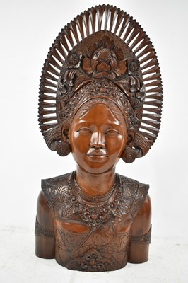 Lot 619 - A well carved and detailed Balinese carved...