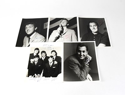 Lot 618 - Five black and white promotional photographs...