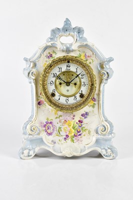 Lot 6419 - An early 20th century ceramic mantel clock...