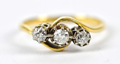 Lot 299 - An 18ct yellow gold and platinum three stone...