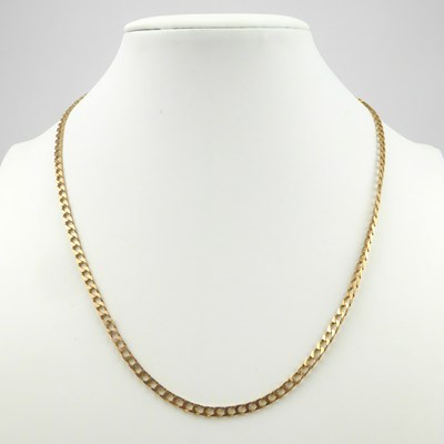 Lot 946 - A 9ct gold flat curb necklace with lobster...