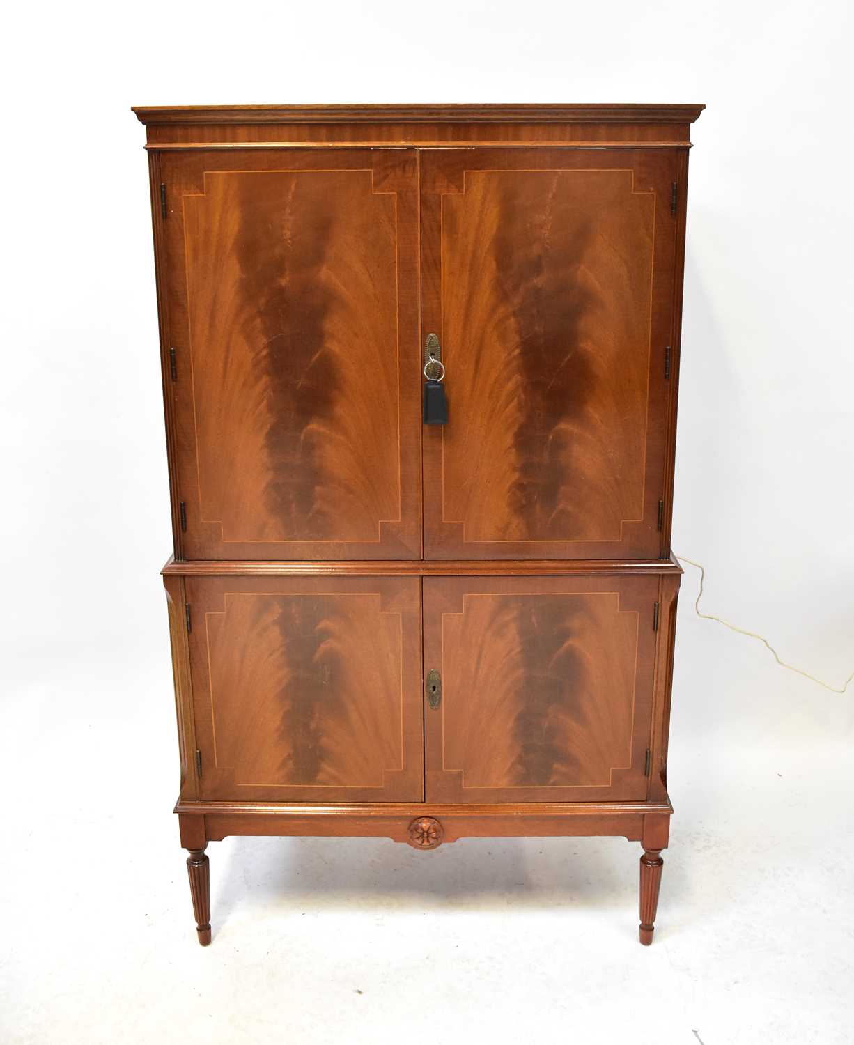 Lot 30 - A Regency-style mahogany drinks cabinet, the...
