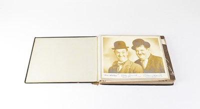 Lot 635 - LAUREL & HARDY; a photograph album containing...