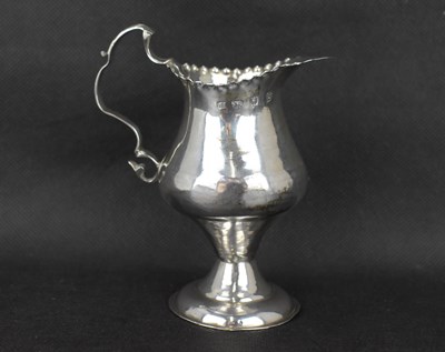 Lot 726 - A George III hallmarked silver cream jug of...