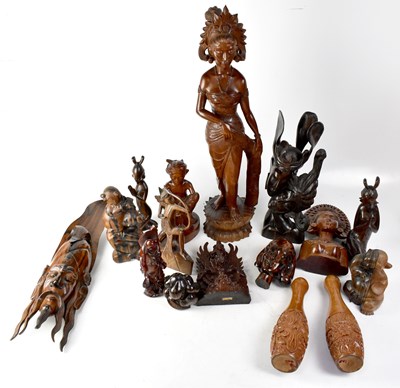 Lot 438 - A quantity of Oriental and Eastern hardwood carved figures