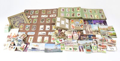 Lot 603 - A collection of cigarette cards, both loose...