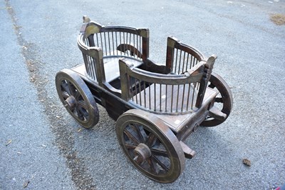 Lot 2490 - A decorative brass bound child's cart, length...