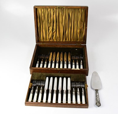 Lot 718 - An oak cased dessert knife and fork set for...