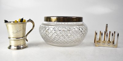Lot 668 - A George V hallmarked silver four-slice toast rack of square form