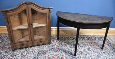Lot 34 - A French glazed corner cabinet with two doors...