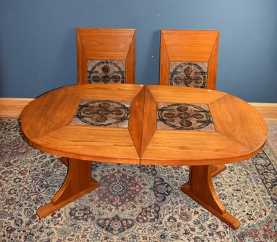 Lot 6706 - A Danish teak extending dining table, with two...