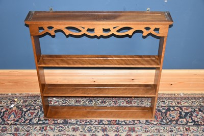Lot 6748 - An oak hanging shelf with pierced gallery,...