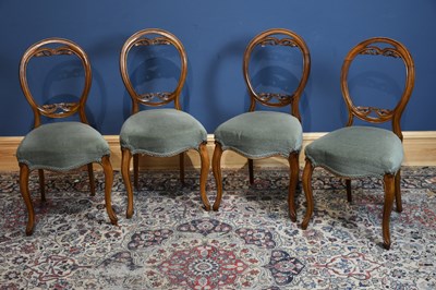 Lot 6632 - Four Victorian balloon back chairs on sabre legs.