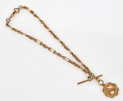 Lot 2979 - A 9ct yellow gold trombone link Albert chain...