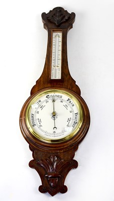 Lot 107 - An early 20th century oak cased banjo barometer