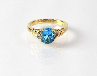 Lot 854 - A 10ct gold ring set with topaz, with a small...