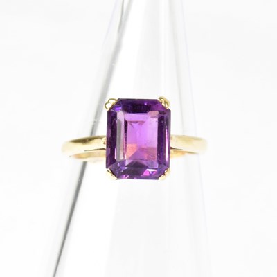Lot 876 - A 9ct gold ring set with an emerald cut...