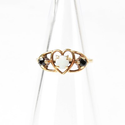 Lot 879 - A 9ct gold sapphire and opal set ring in a...