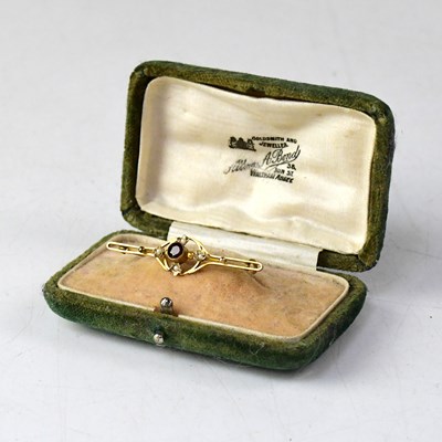 Lot 926 - An Edwardian 9ct gold bar brooch set with...