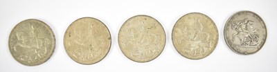 Lot 903 - A group of five rocking horse crowns.