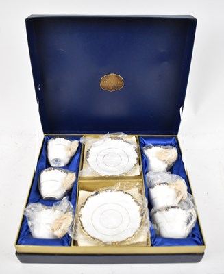 Lot 555 - COALPORT; a blue and gilt decorated set of six...