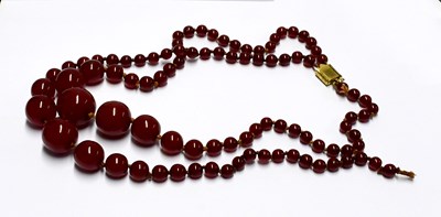 Lot 969 - Two cherry amber-style necklaces