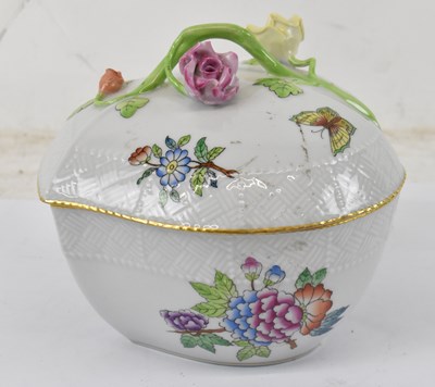 Lot 558 - HEREND; a floral white painted lidded pot...