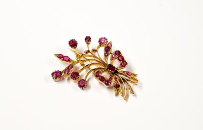 Lot 910 - A yellow metal open work brooch in the form of a spray of flowers