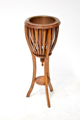 Lot 45 - A 20th century mahogany jardinière stand