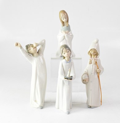 Lot 327 - LLADRÓ; four figures of children in nightgowns,...