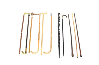 Lot 136 - Eleven walking sticks, including an ebonised...