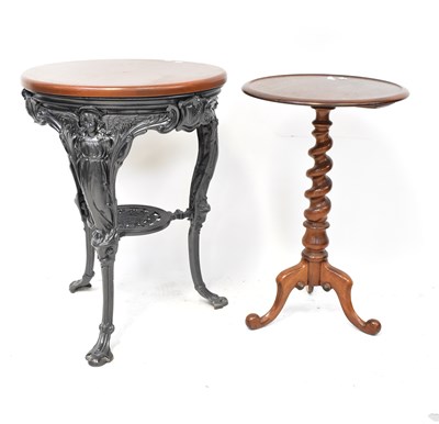 Lot 53 - A Georgian-style circular tea table on...