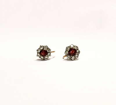 Lot 934 - A pair of yellow metal screw fitting earrings