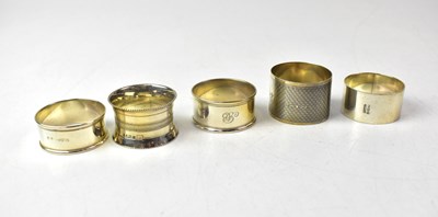 Lot 751 - Five hallmarked silver napkin rings, various...