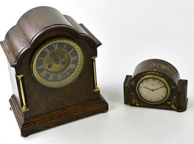 Lot 6424 - An oak cased 1920s mantel clock, the black...