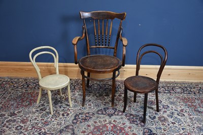 Lot 6703 - AFTER THONET; a bentwood framed elbow chair,...