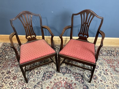 Lot 6688 - A pair of mahogany open arm elbow chairs.
