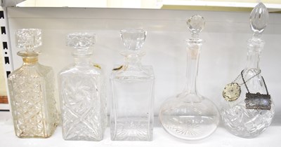 Lot 592 - A group of five cut glass decanters, with two...