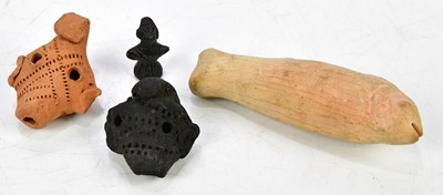 Lot 1219 - Two stoneware whistles modelled on South...