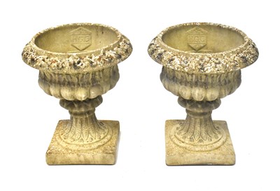 Lot 97 - A pair of reconstituted stone garden urns of...