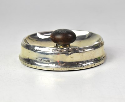 Lot 664 - A George V hallmarked loaded silver ashtray...