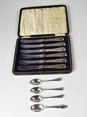 Lot 710 - Four George V hallmarked silver teaspoons,...