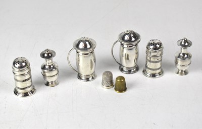Lot 753 - Six hallmarked silver pepper pots, a...