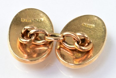 Lot 977 - A pair of 9ct gold cufflinks of oval form,...