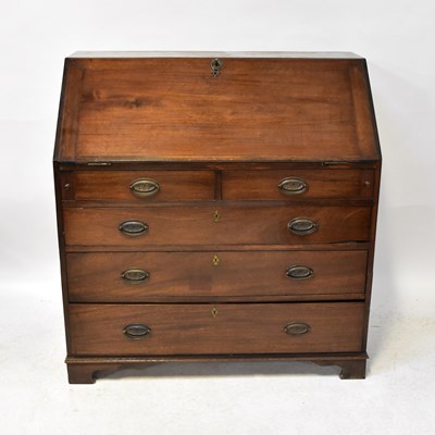 Lot 34 - A 19th century mahogany bureau, the fall front...