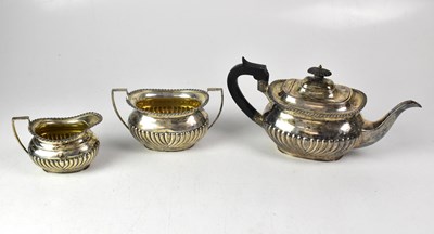 Lot 699 - A George V hallmarked silver three-piece tea...