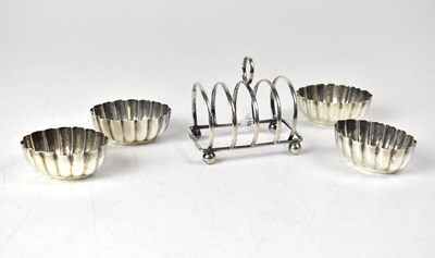 Lot 757 - A hallmarked silver four-division toast rack,...