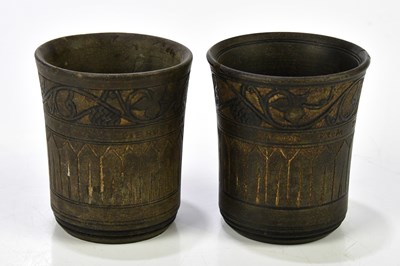 Lot 1418 - Two carved beakers, 'Stone from the Dead Sea',...