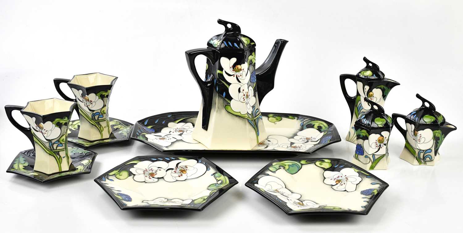 Lot 65 - MOORCROFT; a rare and unusual 'Au Lait' eleven...