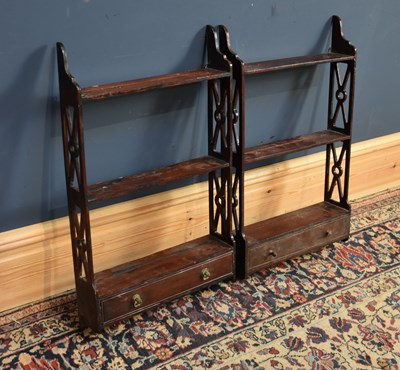 Lot 144 - A pair of George III style mahogany hanging...